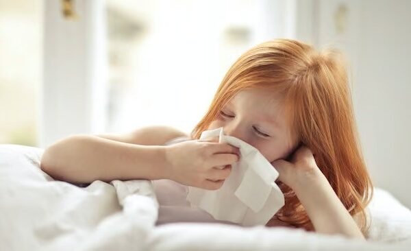 a girl blowing her nose